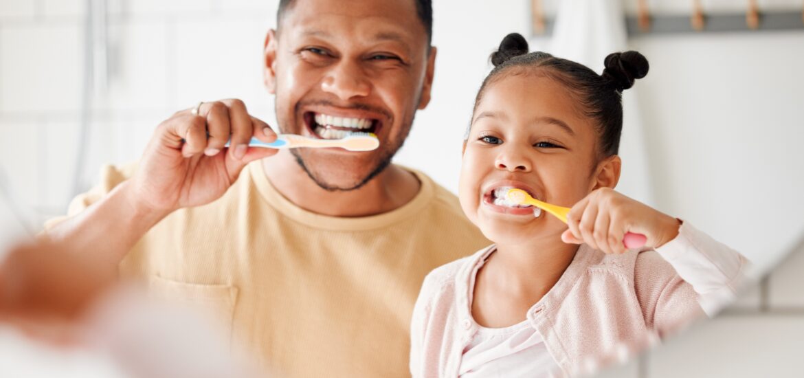 father and daughter practicing preventive dentistry in Wilmette