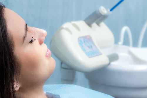 relaxed woman in a dental chair, dental sedation